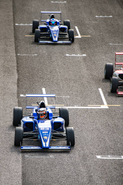 istock Formula race car driver waving after winning 1126024081