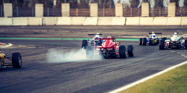 istock Single-seater race cars going into a bend 1126024191