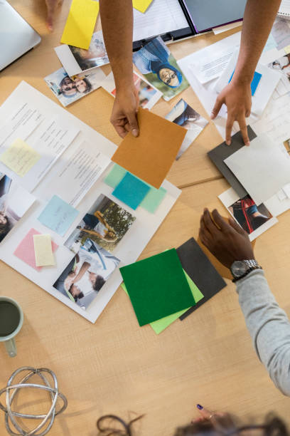 istock Bird's eye view of human hands working a professional design project 1126024399