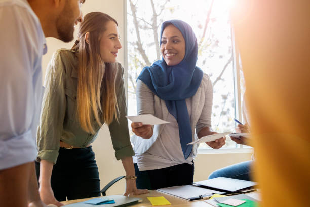 istock Design professional shares ideas during meeting 1126024402