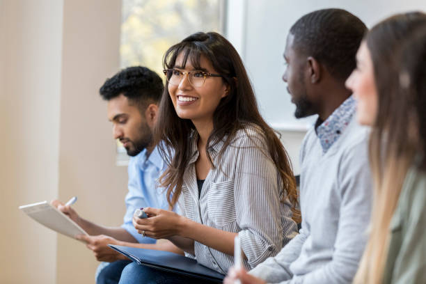 istock Young businesswoman enjoys employee training class 1126024412