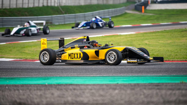 istock Formula cars on the race track 1126026030