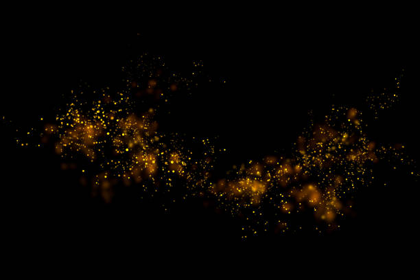 istock Gold glitter particles lights and bokeh on a black background. Christmas abstract sparkle texture. 1126027982
