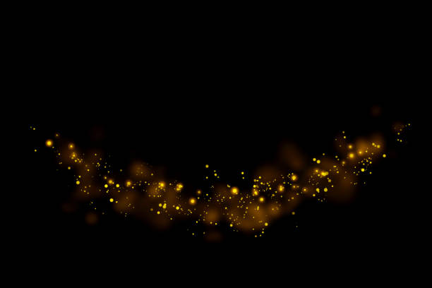 istock Gold glitter particles lights trail and bokeh on a black background. Abstract line sparkle texture. 1126027983