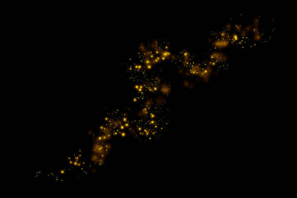 istock Gold glitter particles lights trail and bokeh on a black background. Abstract line sparkle texture. 1126027988