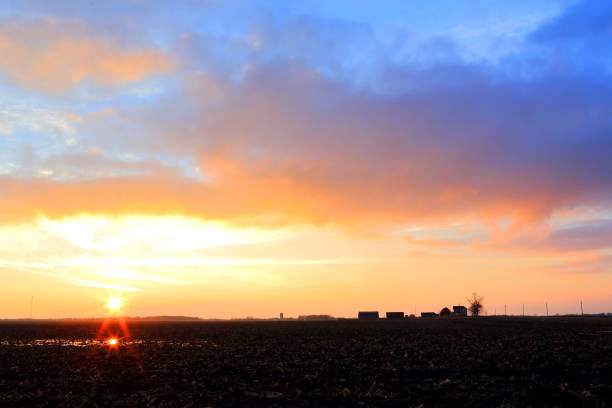 istock Winter Dairy Farm at Sunset 1126028197