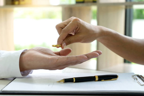 istock Hand man woman on paper with marry ring 1126032279