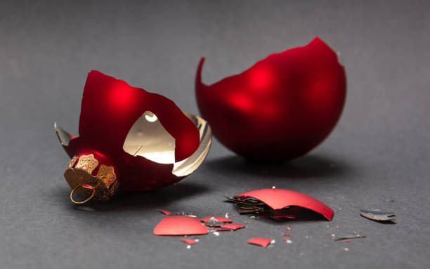 istock Red Christmas ball broken, dark gray background, closeup view 1126042073