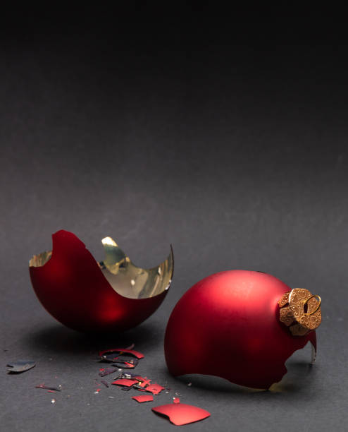 istock Red Christmas ball broken, dark gray background, closeup view 1126042076