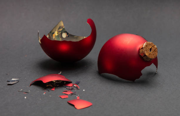 istock Red Christmas ball broken, dark gray background, closeup view 1126042077