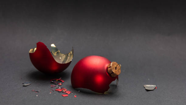 istock Red Christmas ball broken, dark gray background, closeup view 1126042078