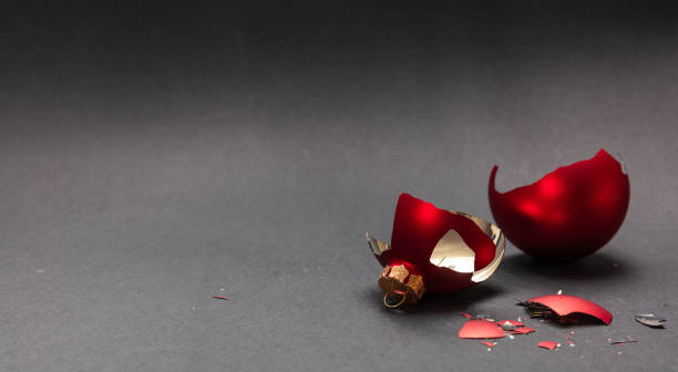 istock Red Christmas ball broken, dark gray background, closeup view 1126042079