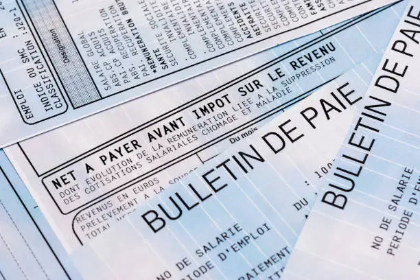Close up on a french payroll with social contributions and income tax deduction, mandatory in France since January 2019