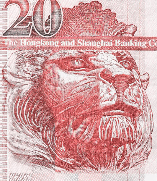British lion on the fragment of old twenty Hong Kong Dollars banknote close-up British lion on the fragment of old twenty Hong Kong Dollars banknote close-up. Living coral color toned image bills lions stock pictures, royalty-free photos & images