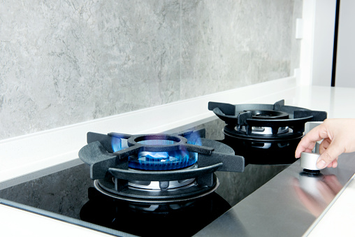 Blue Flames Of Gas Stove In Kitchen