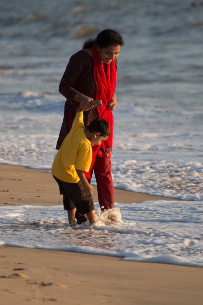 istock mother and son  in beach 1126047218