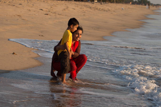 istock mother and son  in beach 1126047592