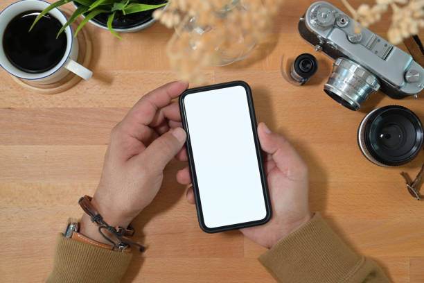 istock Creative stylish hand holding blank screen mobile phone 1126048587