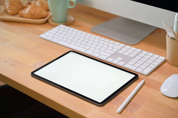 istock Office desk workspace with blank screen tablet and office supplies 1126048884