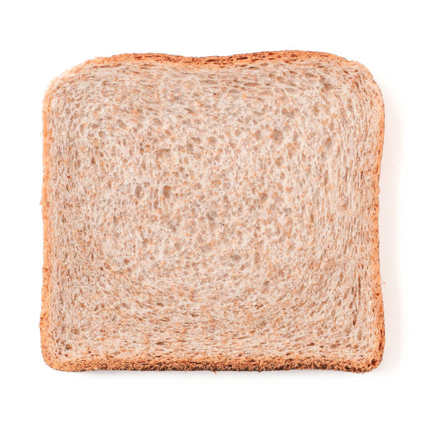 Bread slice isolated on white with clipping path Bread slice isolated on white, clipping path. Slice of multigrain bread square form for toast. Image of one slice wholegrain bread, top view or flat lay. slice of bread stock pictures, royalty-free photos & images