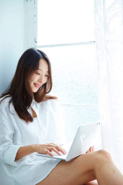 istock Korean woman using laptop 1126049790