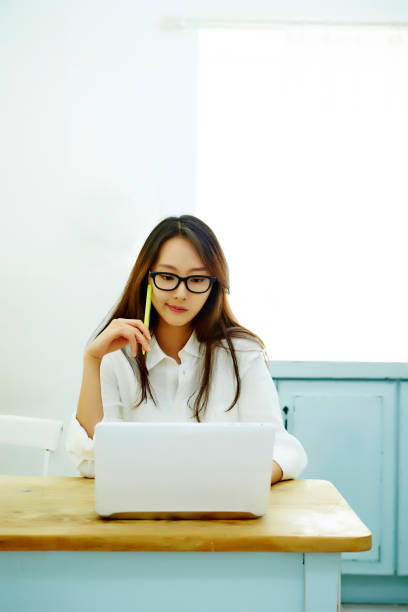 istock Korean woman using laptop 1126049903