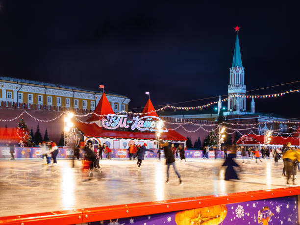 Famous skating rink on Red square near GUM (Main department store). Walking people, shooting with long-exposure. Moscow, Russia - December 03, 2017. Famous skating rink on Red square near GUM (Main department store). Walking people, shooting with long-exposure. long exposure winter crowd blurred motion stock pictures, royalty-free photos & images