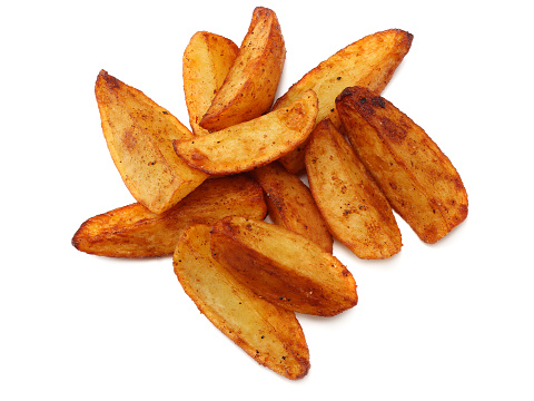 Fried potato wedges isolated on white background. top view. Fast food