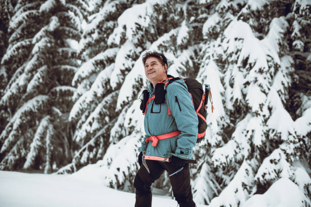 istock Senior Alpinist Posing In The Mountain 1126055639