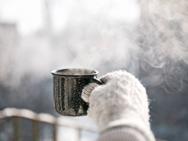 istock Woman hands holding hot cup coffee, tea 1126057003