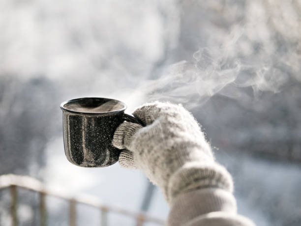istock Woman hands holding hot cup coffee, tea 1126057019