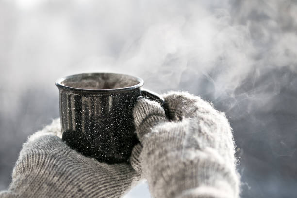 istock Woman hands holding hot cup coffee, tea 1126057034