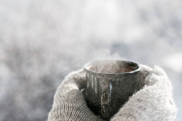 istock Woman hands holding hot cup coffee, tea 1126057084