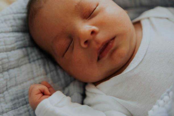 istock Infant baby fast asleep on the bed 1126057143