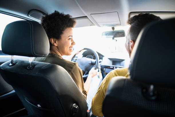 istock Two people sitting in the car together and going on a trip 1126058235