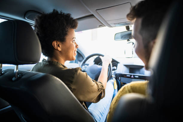 istock Two people sitting in the car together and going on a trip 1126058315