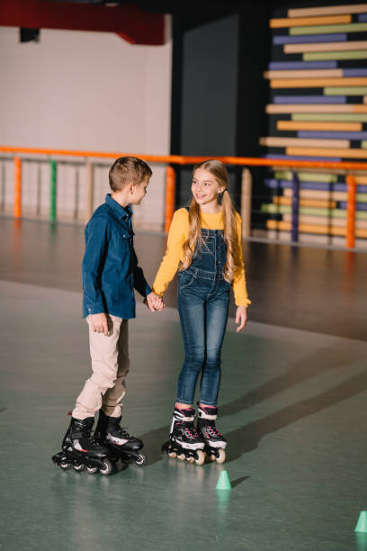 istock Beautiful smiling skating and holding hands 1126058598