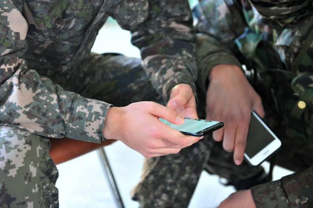 South Korean Army Soldiers Using Smartphones stock photo