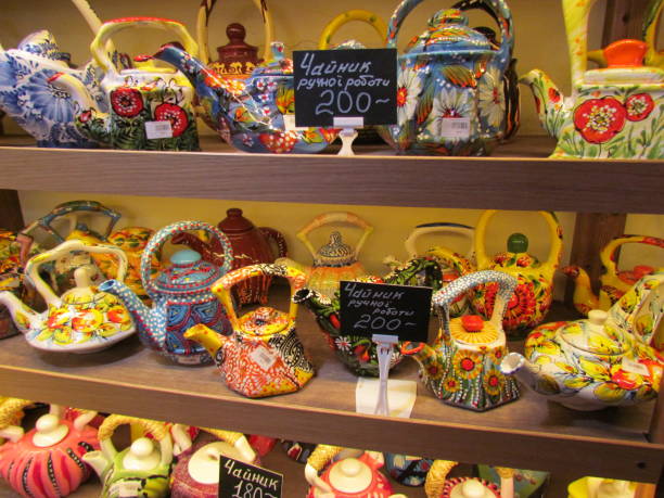 istock Many colorful teapots made by hand 1126059627