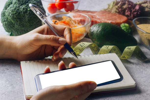 istock Woman using calorie counter application on her smartphone 1126060162