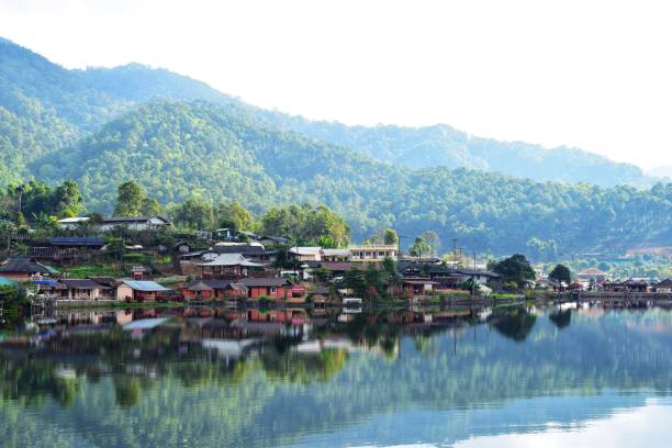 istock lake and mountain with cloud in morning 1126061811