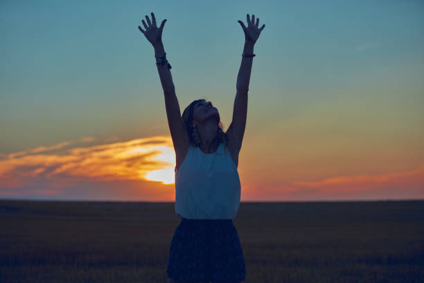 istock Cute young woman jumping in a wheat field. 1126062125
