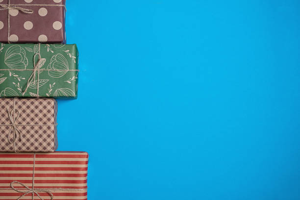 istock Varied and bright gifts on a blue background 1126063417