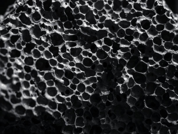 黒い石の多孔質テクスチャ自然抽象的な背景 - volcanic stone ストックフォトと画像
