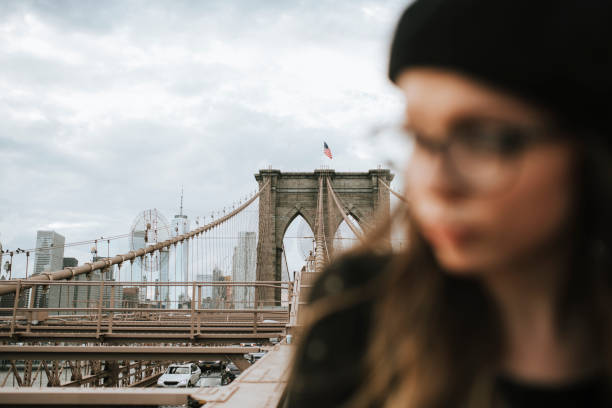 istock Woman on the Brooklyn Bridge, USA 1126063611