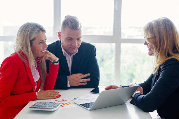 istock Couple in meeting with financial advisor 1126063699