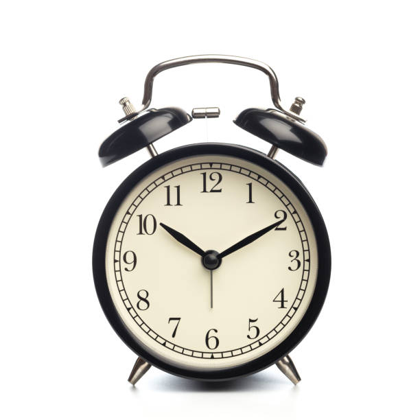 istock Black retro alarm clock on isolated background 1126063885