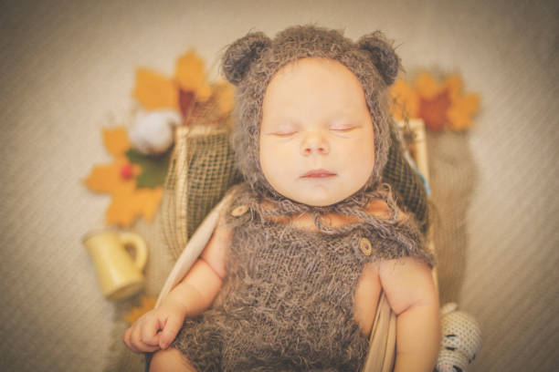 istock Newborn in a brown hat with ears 1126064454