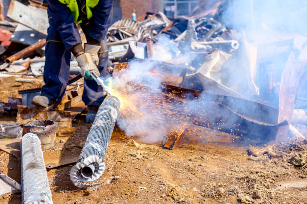 istock Worker is cutting scrap metal with acetylene torch 1126065945