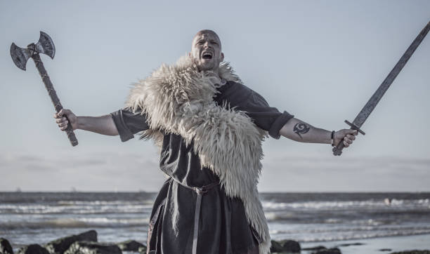 istock An individual viking warrior on a beach at the water's edge 1126071094